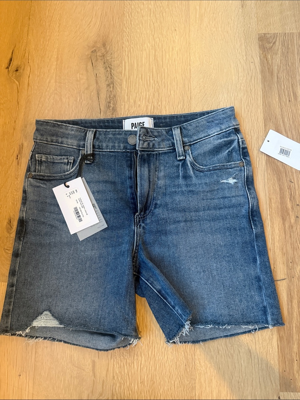 PAIGE Washed Blue Distressed Denim Cutoff Shorts